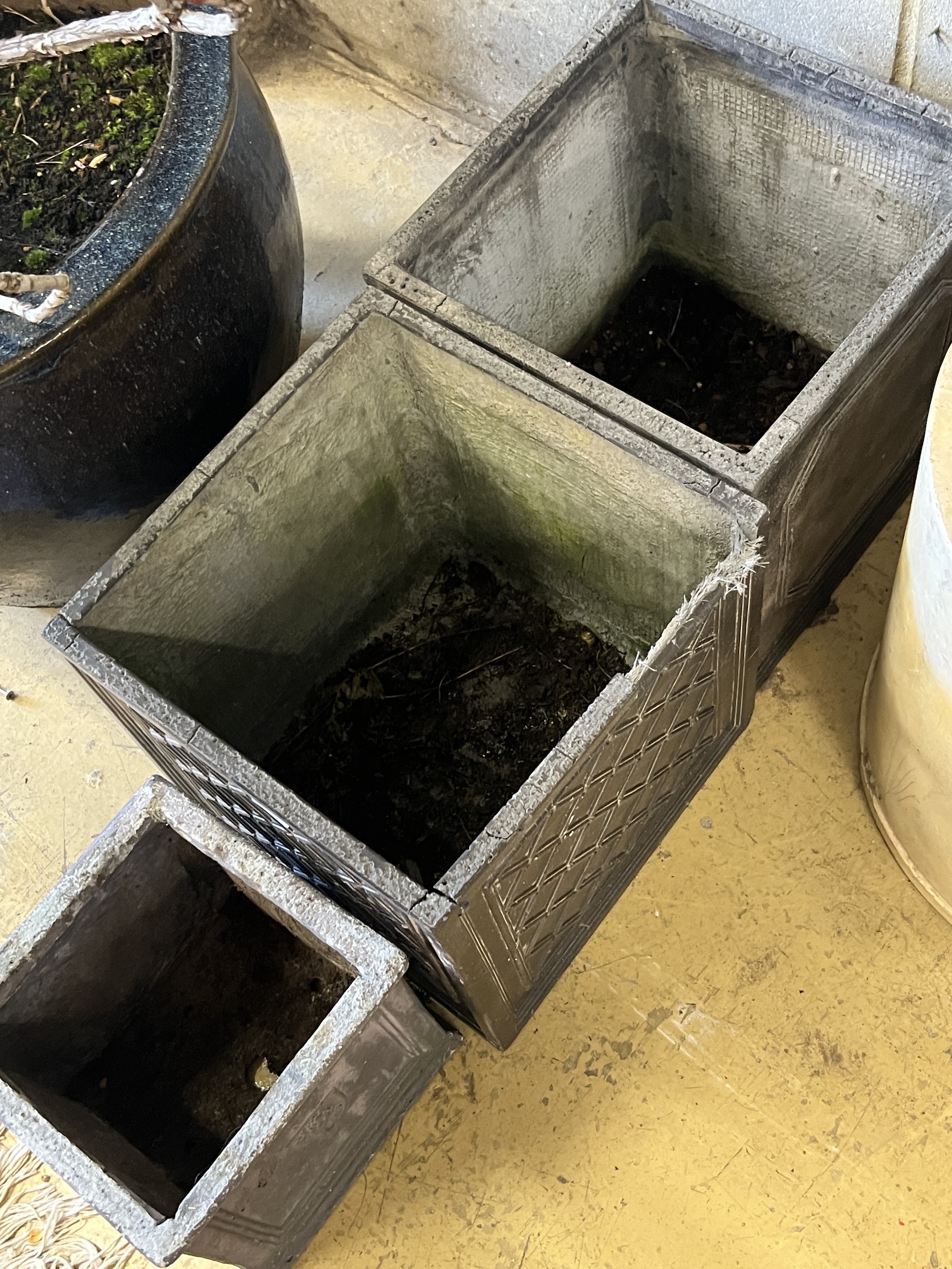 Three composition faux lead square garden planters, larger width 32cm, height 32cm